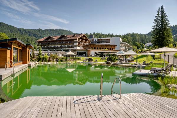 Aerial view of the Zugspitz Resort campsite with a large swimming pool and mountain views.