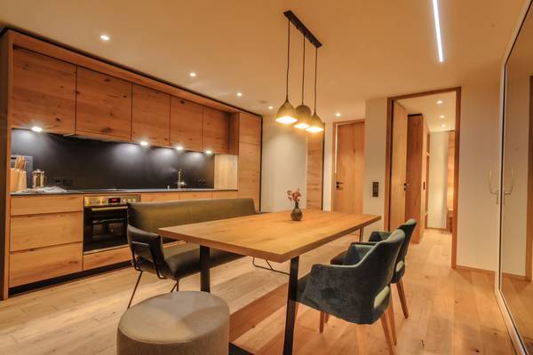 Aerial view of Camping Wirthshof campsite with many tents and houses.