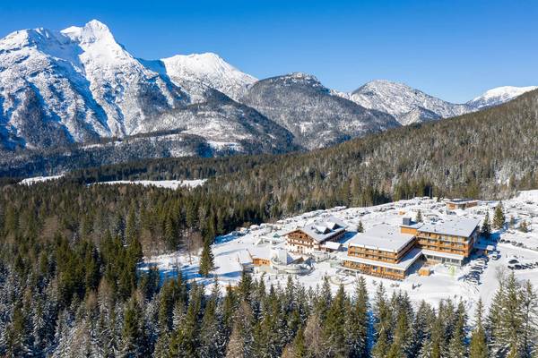Zugspitz Resort covered in snow with mountains in the background