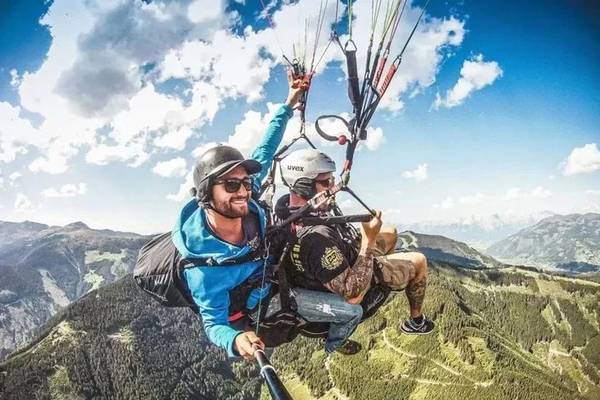 Night view of Sportcamp Woferlgut with an outdoor pool and water slide illuminated.