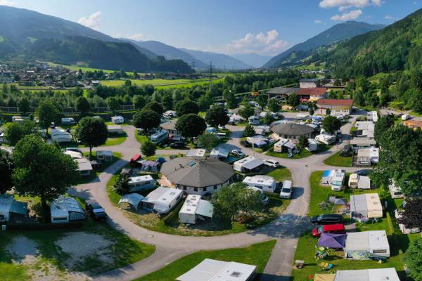 Aerial view of Erlebnis Resort Aufenfeld campsite with many caravans and motorhomes.