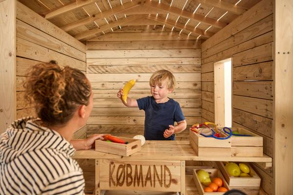 Child playing in a wooden shop at Henne Strand Resort
