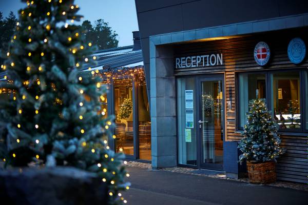 Front entrance of Henne Strand Resort reception during night with Christmas decorations