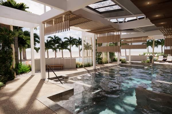 Área de piscina al aire libre en Camping Les Mouettes con tumbonas y árboles tropicales.