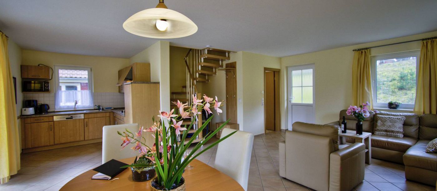 Interior of Camping- und Ferienpark Havelberge with living room, dining table, and kitchen